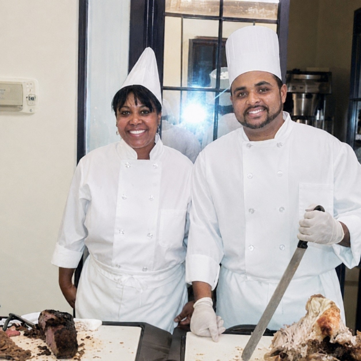 Maria Mosquera working in a professional kitchen setting.